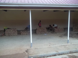Students at the Vocational School complete their practicum of brick laying.  